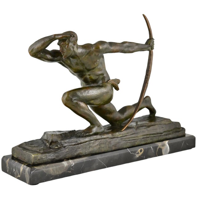 Art deco bronze sculpture athlete with bow, archer. By Pierre Le Faguays. Bronze with green patina on Portor marble base....