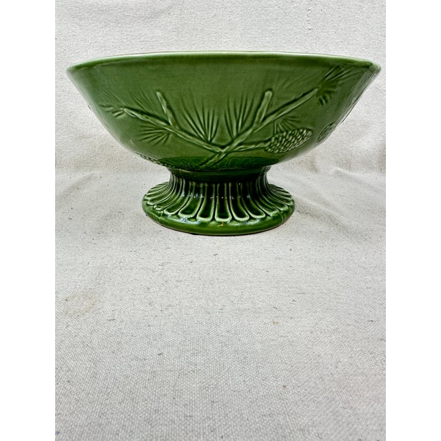 Large green ceramic bowl with embossed pinecone and branch motif. This is a pre-owned item so please see all pictures and...
