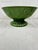 Large green ceramic bowl with embossed pinecone and branch motif. This is a pre-owned item so please see all pictures and...