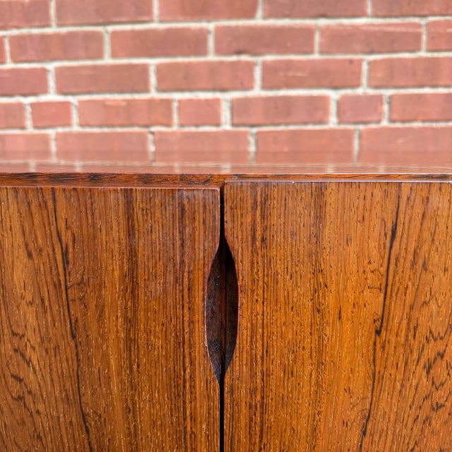 Danish modern rosewood credenza by Omann Jun, with beautifully figured rosewood grain across the front, top and sides. Two...