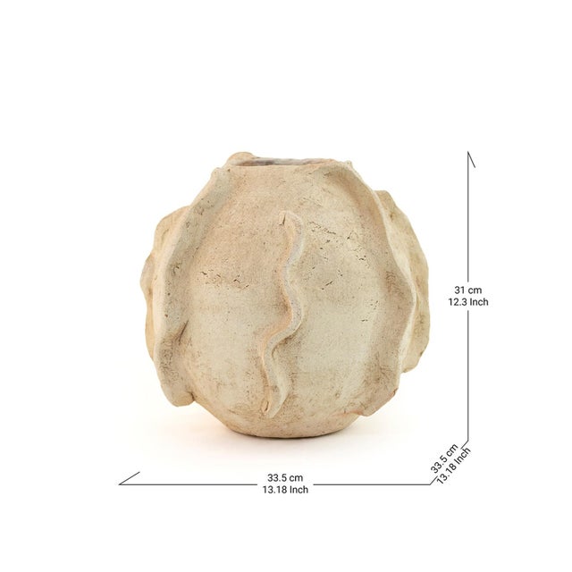Soft, undulating waves ripple across the surface of this Tamegroute vase, its creamy terracotta body shaped as if still...