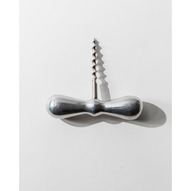 This vintage metal corkscrew from 1950s Italy features a timeless and elegant form, crafted in silver-toned metal with...