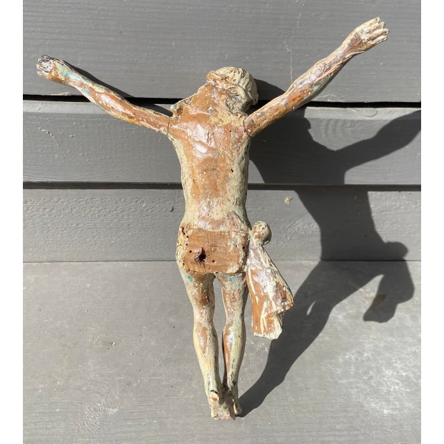 An expressive antique carved wooden sculpture depicting Christ, originating from France and dating from the late 18th to...