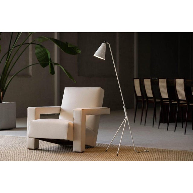 A refined and rare example of danish mid-century lighting, this grasshopper floor lamp was designed by svend aage holm-...