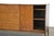 A mid century modern solid maple sideboard credenza designed by Paul McCobb for Winchendon’s Planner Group with brass...