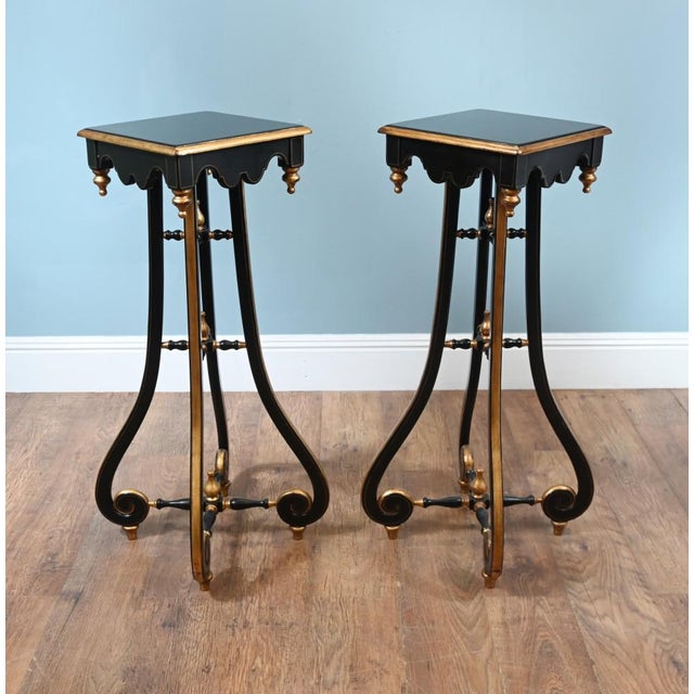 A rare pair of Arts and Crafts pedestal stands from the aesthetic period Lovely black lacquer finish with gilt accents...