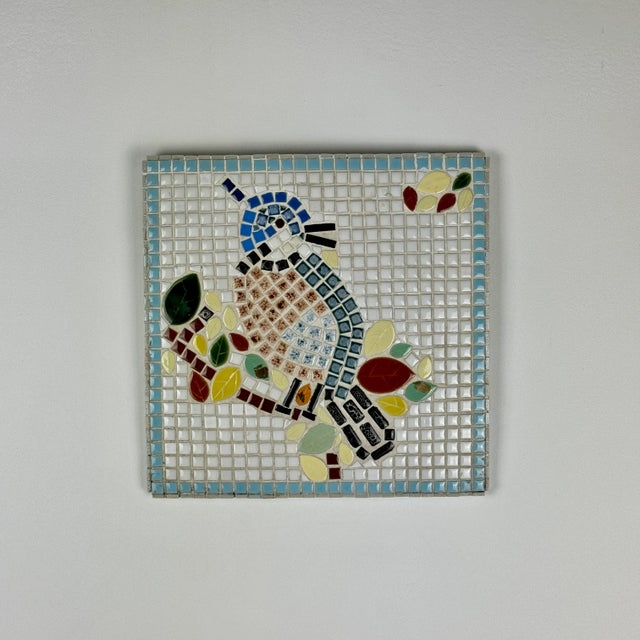 A gorgeous Mid-Century Modern vintage mosaic tile art of bird on a branch. It is signed on the back right corner Leo...