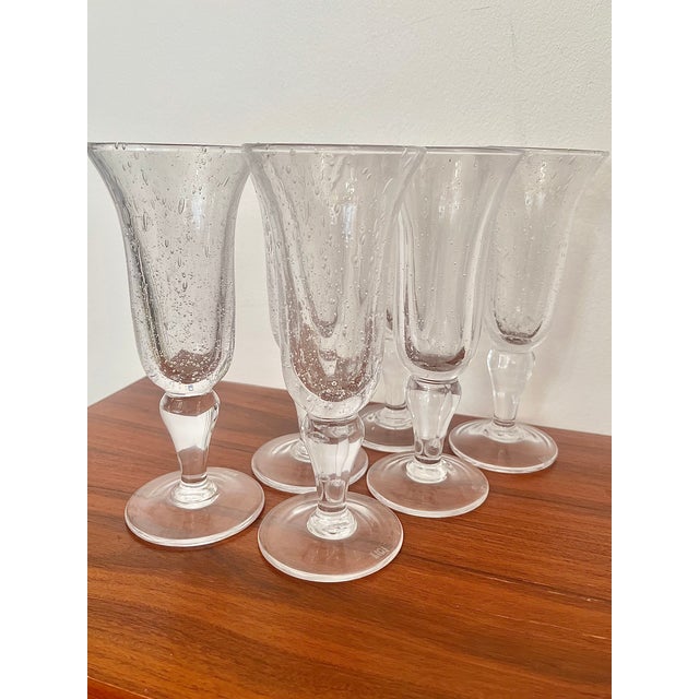 A magnificent expression of french art glassmaking. elegant and striking, these 18 cm tall biot glasses are truly...