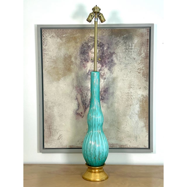 Like a great piece of turquoise jewelry. A pair of massive undulating TURQUOISE sculptures of a lamp by The Marbro Lamp...