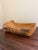 A beautifully sculptural hand-carved wood bowl with a naturally organic silhouette and richly textured live-edge exterior....