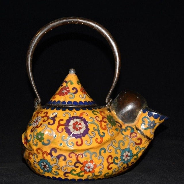 This is a finely crafted antique cloisonné enamel ewer or wine pot, featuring a unique design centered around a figure of...