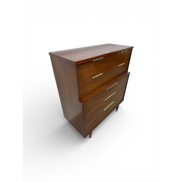 This Kent Coffey Tableau walnut dresser is a striking example of refined Mid-Century Modern design. Crafted from...