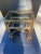 A pair of gilt metal rope and tassel tables with glass tops . Very hard to find. Most people have the serving cart. Small...
