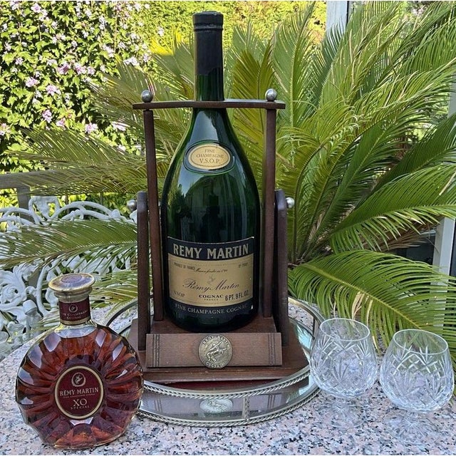 A striking and increasingly scarce vintage rémy martin v.s.o.p. Fine champagne cognac promotional display bottle,...