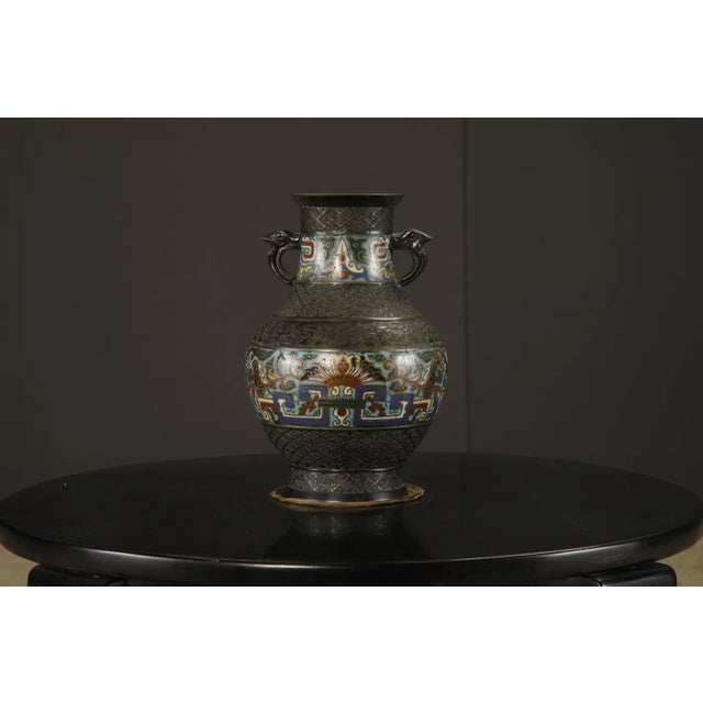 A striking Japanese cloisonné and bronze vase with original embroidered silk stand pad, crafted during the Taishō to early...