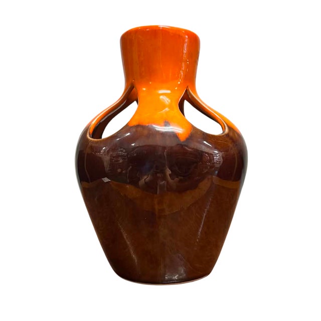 A striking vintage West German ceramic vase showcasing the bold colors and sculptural forms that define the celebrated Fat...
