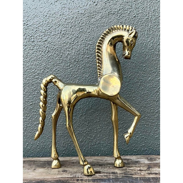 This striking prancing horse sculpture is a masterful expression of mid-century design, drawing inspiration from ancient...