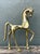 This striking prancing horse sculpture is a masterful expression of mid-century design, drawing inspiration from ancient...