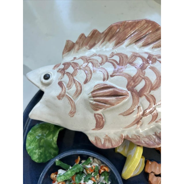 This beautiful wall plate features a stunning fish design in vibrant colors. It is a must-have for collectors of ceramic...