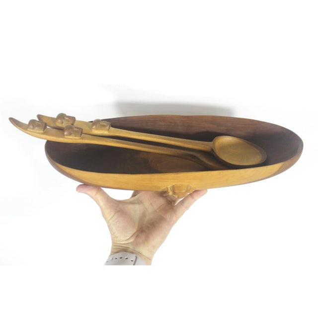 Absolutely stunning serving platter with a long handled spoon and fork. The bowl has a face protruding from each side and...