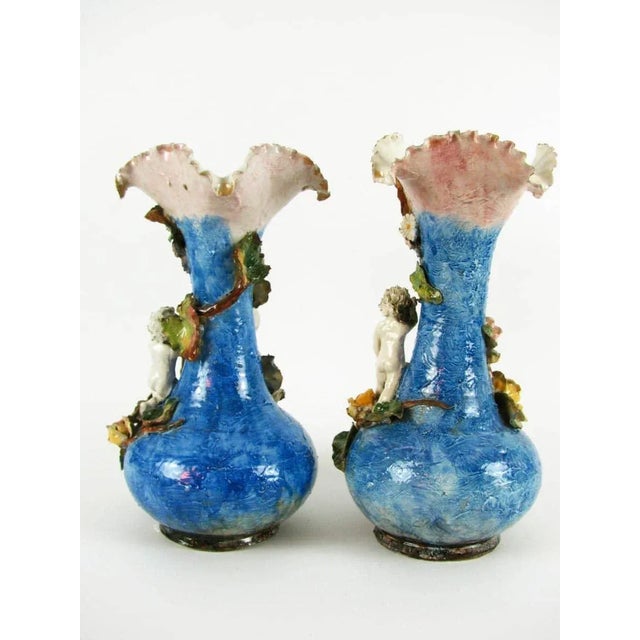 Pair of Art Nouveau polychrome ceramic vases, bottle-shaped vases with jagged and wavy edges, made in polychrome ceramic,...