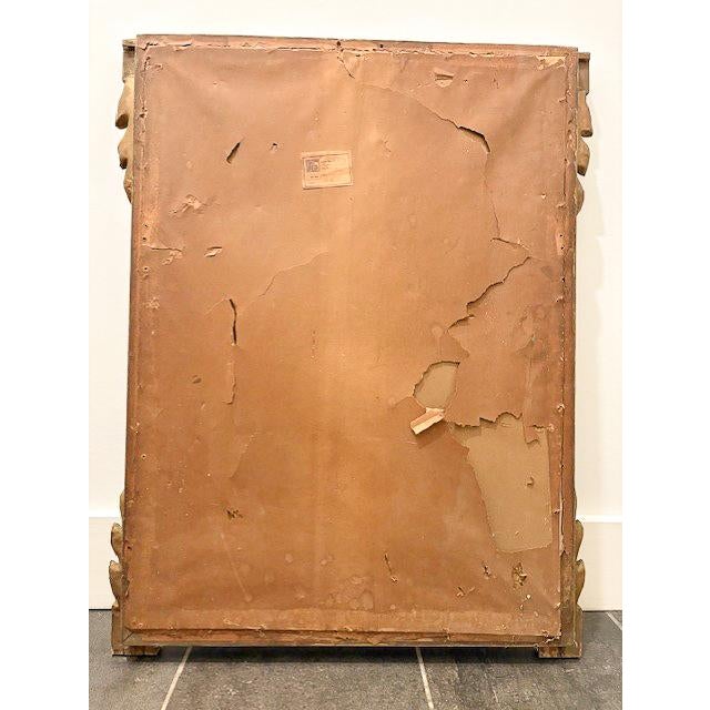 A beautifully crafted wooden mirror by Friedman Brothers, featuring a rich gold finish and intricate, traditional...