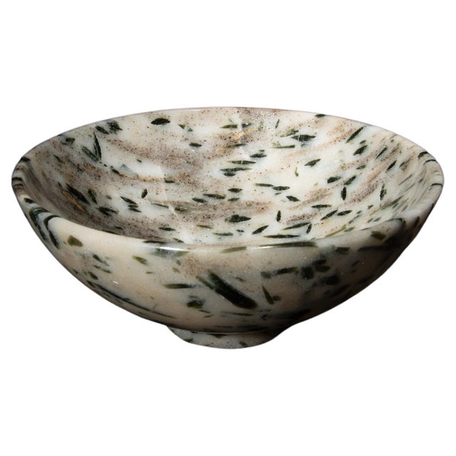 This 6-inch Tourmaline Quartz Bowl is a stunning showcase of nature's artistry, blending the clarity of quartz with the...