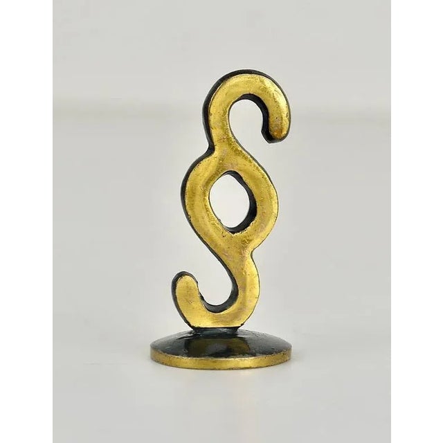 A Midcentury brass figurine, displaying a paragraph form the 1950s. Designed by Walter Bosse, executed by Hertha Baller,...