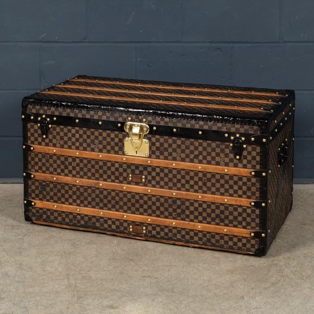 A classic and highly collectible louis vuitton steamer trunk dating to the late 19th / early 20th century, finished in the...