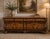 This stunning bombe-shaped credenza exudes old-world craftsmanship. Featuring intricate floral marquetry inlays across its...