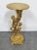 Hollywood regency Italian Gold gilt pedestal, carved with 2 children climbing a tree, paw feet.