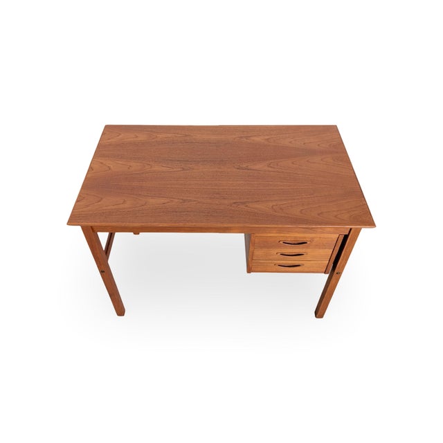We are offering a beautiful mid-century teak desk from the 1960s for sale. This small ladies' desk features three spacious...