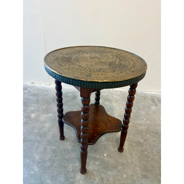 Discovered in Paris, this lovely carved oak side table features a bobbin design on the legs with a sturdy shelf on the...