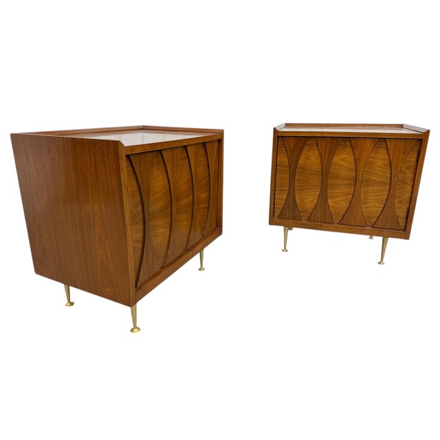 Elevate your space with this stunning pair of 1960’s Mid-Century Modern cat-eye style nightstands, showcasing iconic...