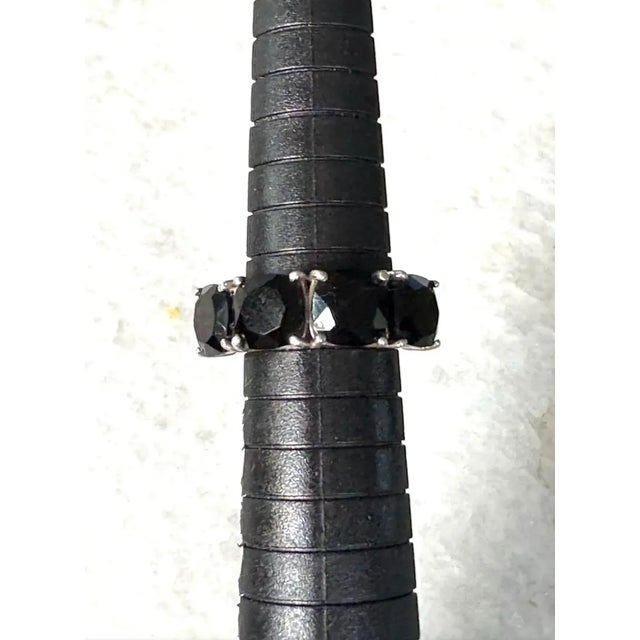 Sleek vintage sterling silver ring with four jet crystals. A tasteful yet dramatic look.