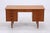 Vintage teak desk from the 1960s with clean lines and a well-thought-out layout. Four drawers, a lockable center drawer,...