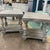 Pair of vintage distressed wooden end tables with unique turned wooden legs supporting the beveled edge top and a bottom...