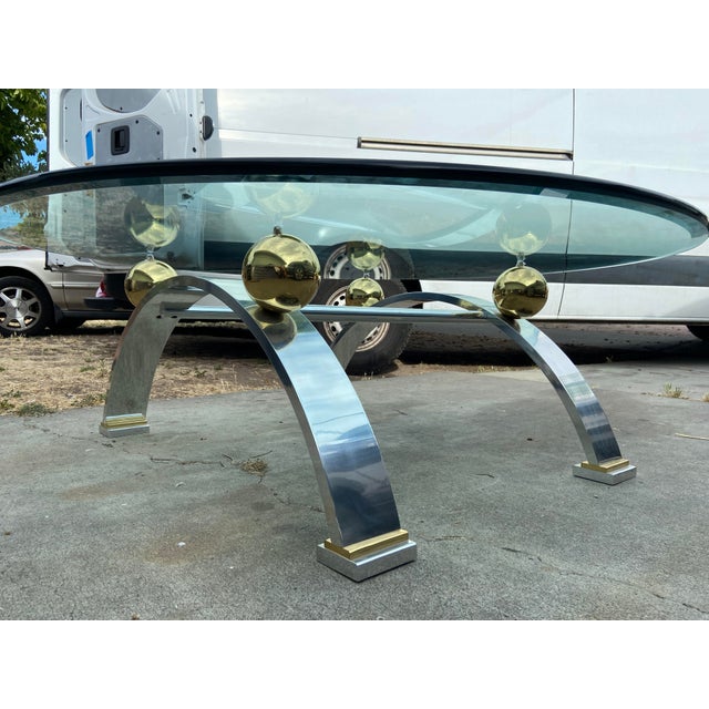 This Vintage Space Age Design Chrome and Glass Atomic Coffee Table exudes Mid-Century Modernism with its round tabletop...