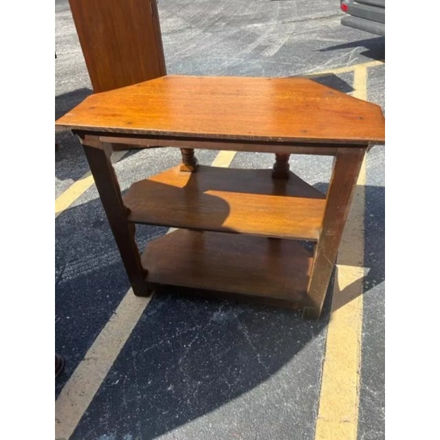 This English Oak 2 Tier Table is a stunning piece of furniture that will add a touch of antique charm to your indoor...