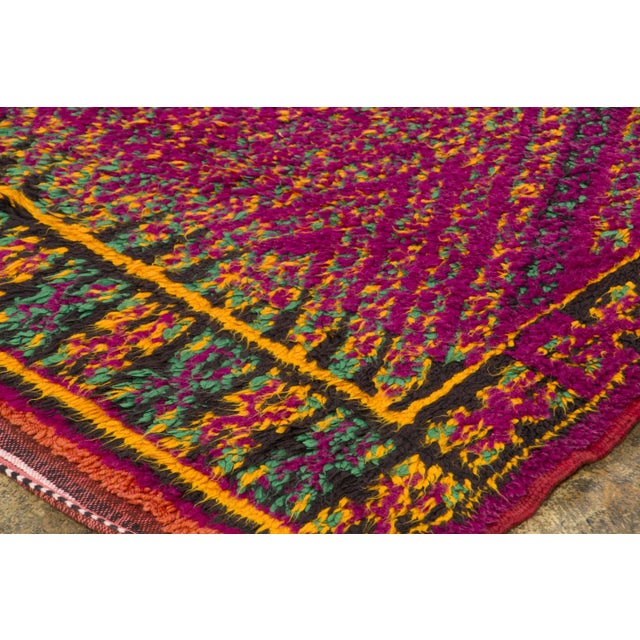 Hand-knotted in wool and originating circa 1950-1959, this 6x9 vintage Moroccan rug joins Rug & Kilim’s Moroccan...