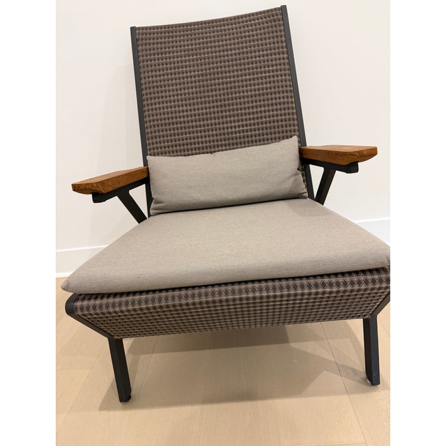 Kettal Vieques,a collection characterized by combination of aluminum frame with dimensional fabric, and teak arms....