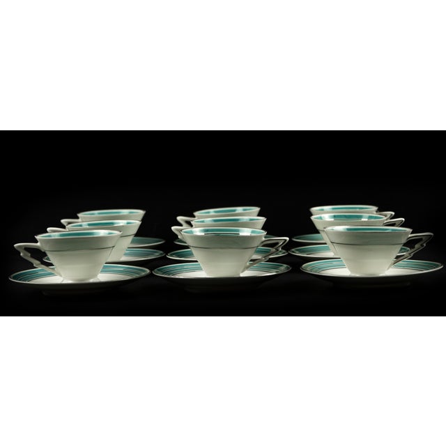 Coffee set is a decorative object realized in the Mid-20th Century. A porcelain set composed by 9 cup and 9 plates finely...