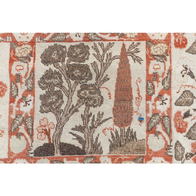 A masterful example of Persian craftsmanship, this antique Tabriz rug from the 1920s is a celebration of artistry,...