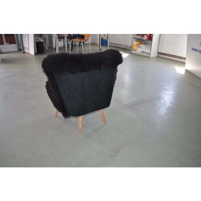 - Cocktail club chair in black sheepskin and beech legs - This has been reupholstered with black lambs-skin - This...