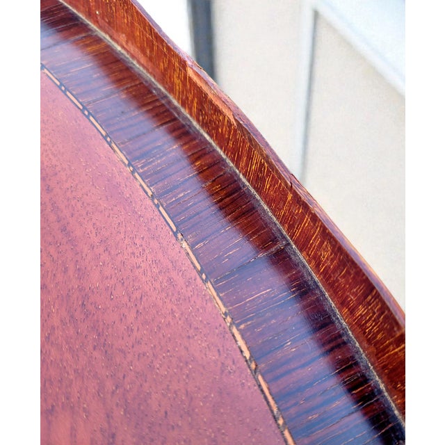 This elegant antique English butler’s serving tray is a refined example of early 20th-century craftsmanship, distinguished...