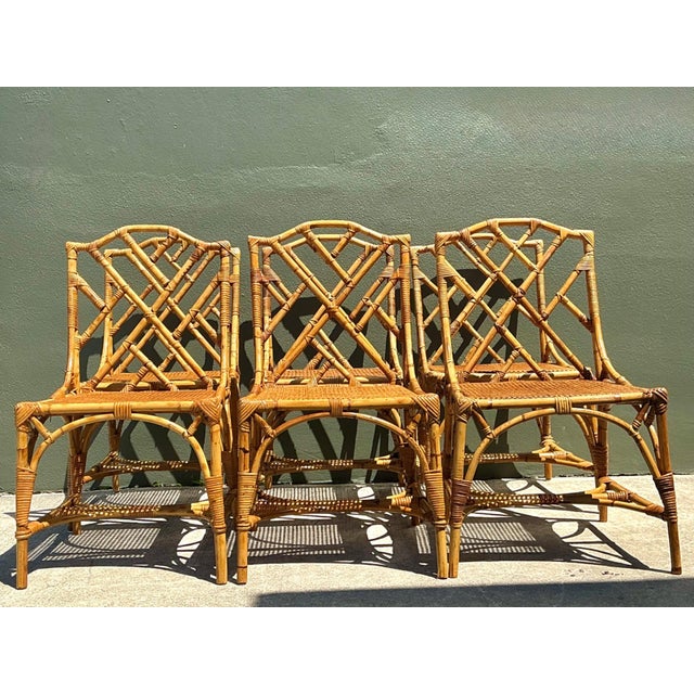 This exquisite set of six vintage dining chairs seamlessly blends the geometric precision of Chinese Chippendale design...
