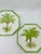 A pair of hand-painted Italian ceramic plates by TanSai featuring tropical palm tree motifs. Each octagonal plate has a...