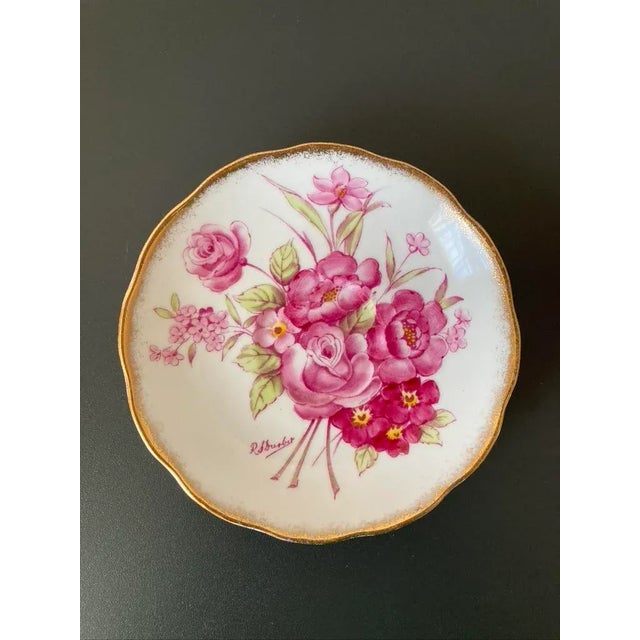 A beautiful dish vide-poche catchall with Victorian design by English porcelain maker, Roslyn, circa early-20th century,...