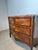 Elegant vintage chest of drawers featuring a beautiful red/brown marble top and a warm wood veneer with decorative inlay....