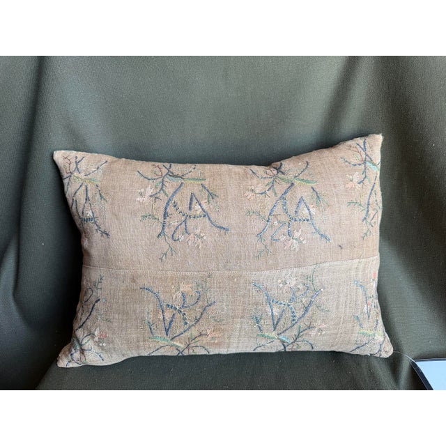 This rare 17th Century Persian Isfahan metallic embroidery pillow is fashioned from an authentic antique silk and linen...